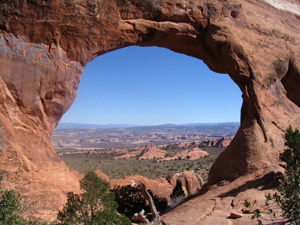 View of Grand Canyon through hole in a rock Metaphor for expansiveness of consciousness